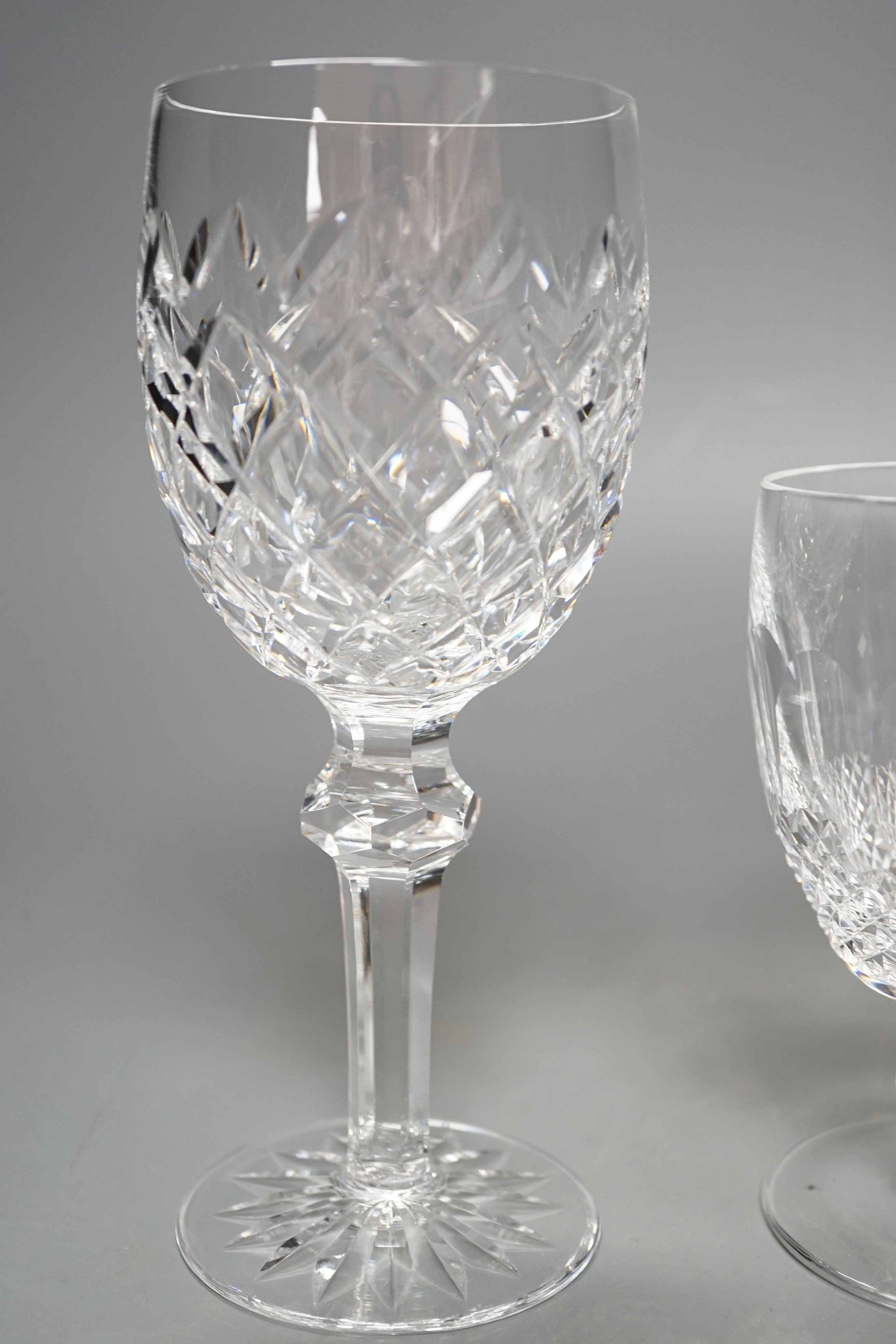 A set of eighteen Waterford cut crystal low goblets and tumblers and twelve further Waterford cut crystal wine glasses in a different pattern